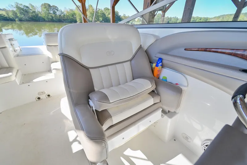 Slide: The Image of Captain's seat on a 2002 Cobalt 262 boat, with lake view in background. - 23