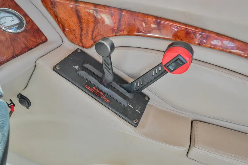 Slide: The Image of Throttle control lever on a 2002 Cobalt 262 boat dashboard. - 29