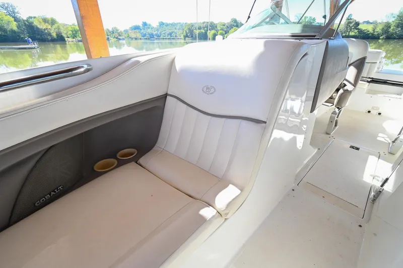 Slide: The Image of Interior of 2002 Cobalt 262 boat with white seating and cup holders. - 36
