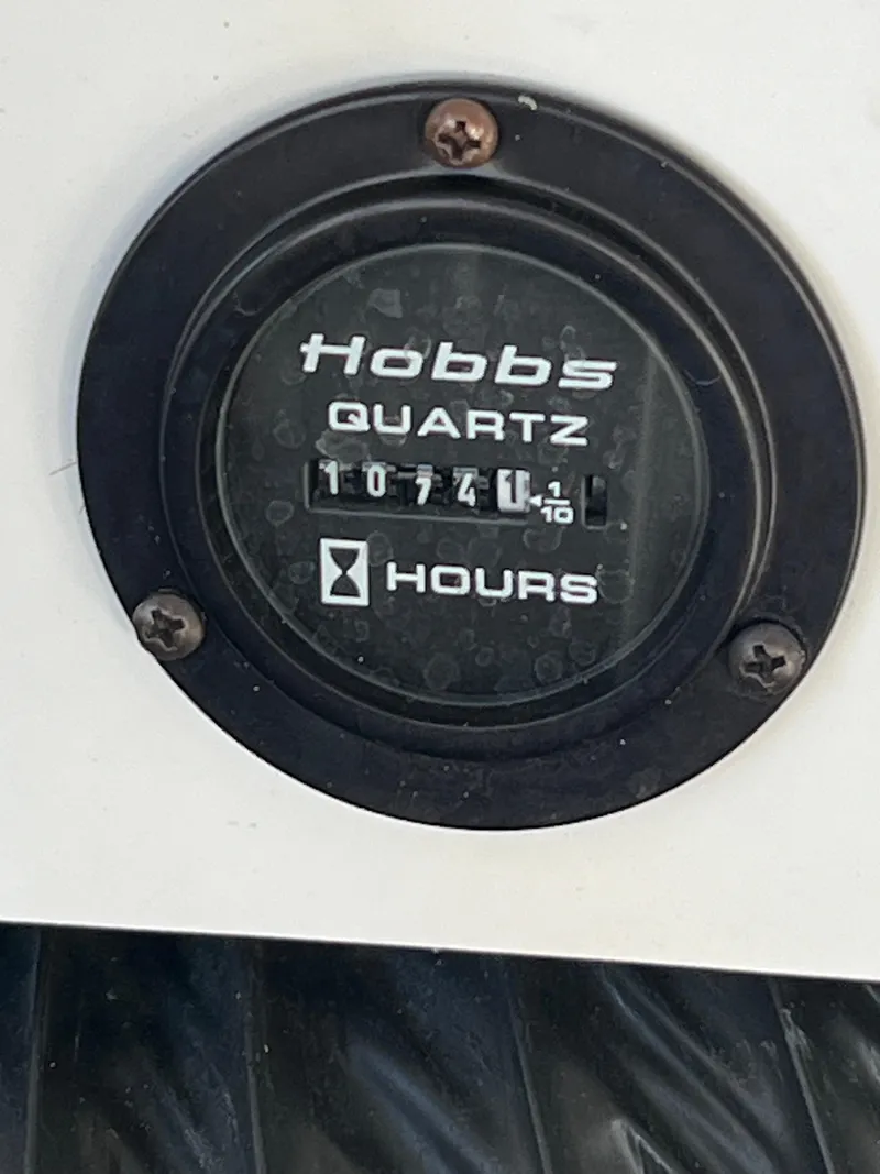 Slide: The Image of Hobbs Quartz hour meter showing 1074.1 hours on a 2002 Cobalt 262. - 42