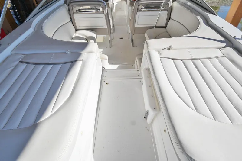 Slide: The Image of 2002 Cobalt 262 boat interior with white leather seating and spacious layout. - 8