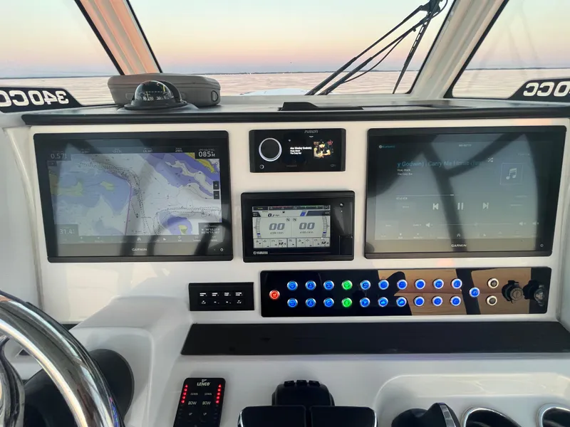 Slide: The Image of Edgewater 340CC 2022 boat dashboard with navigation and control screens. - 18