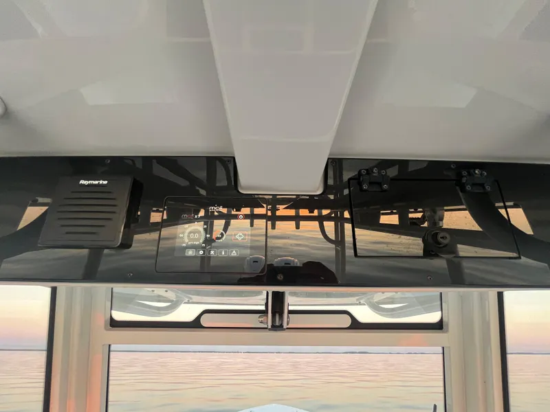 Slide: The Image of 2022 Edgewater 340CC boat dashboard with modern navigation equipment. - 20