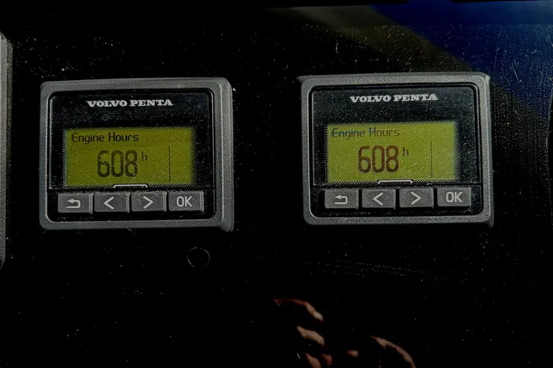 Slide: The Image of Volvo Penta engine hour meters showing 608 hours on Prestige 460 Fly Bridge, 2019 model. - 19