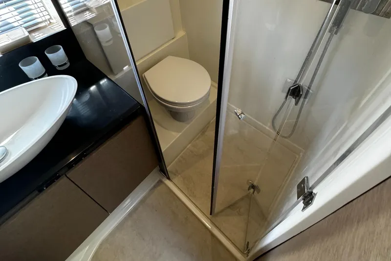 Slide: The Image of Luxurious bathroom in 2019 Prestige 460 Fly Bridge yacht with modern fixtures. - 25