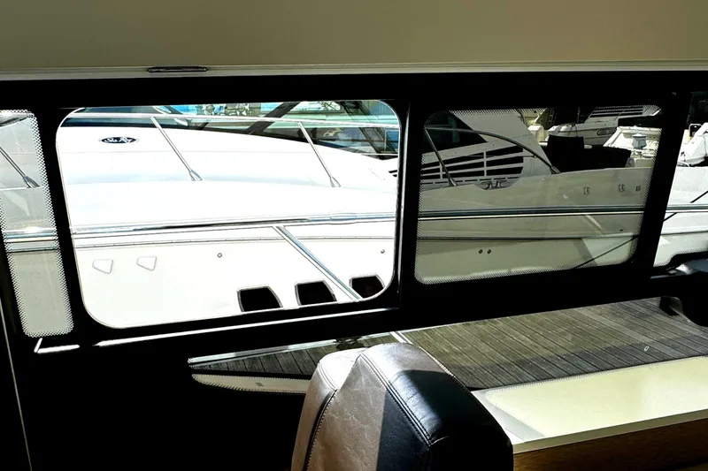 Slide: The Image of View from inside a 2019 Prestige 460 Fly Bridge yacht, showcasing sleek exterior design. - 39