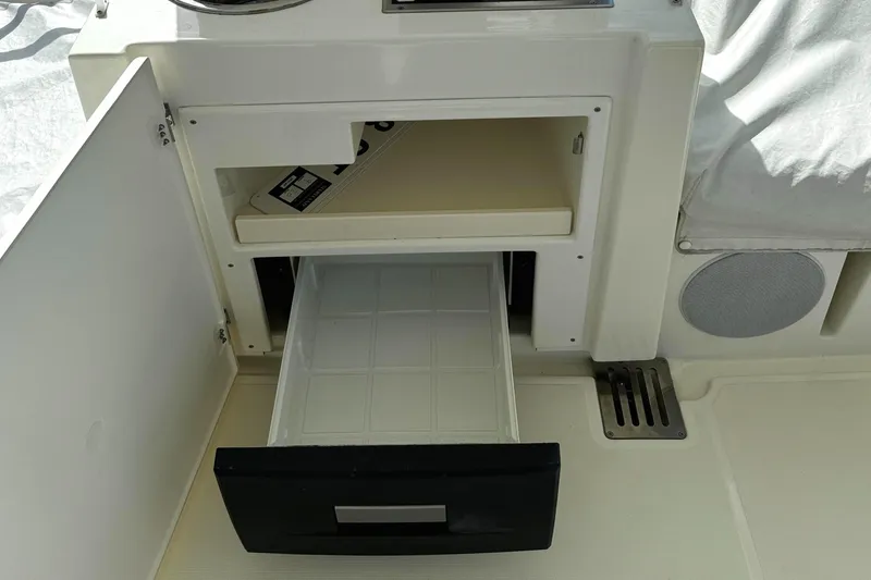 Slide: The Image of Open storage compartment on 2019 Prestige 460 Fly Bridge yacht. - 45