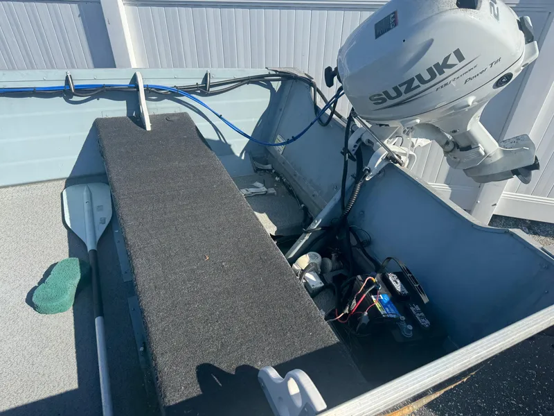 Slide: The Image of 2016 Starcraft SF 14 boat interior with Suzuki outboard motor. - 4