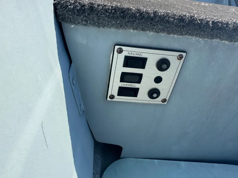 Slide: The Image of Control panel on a 2016 Starcraft SF 14 boat, featuring navigation and livewell switches. - 7