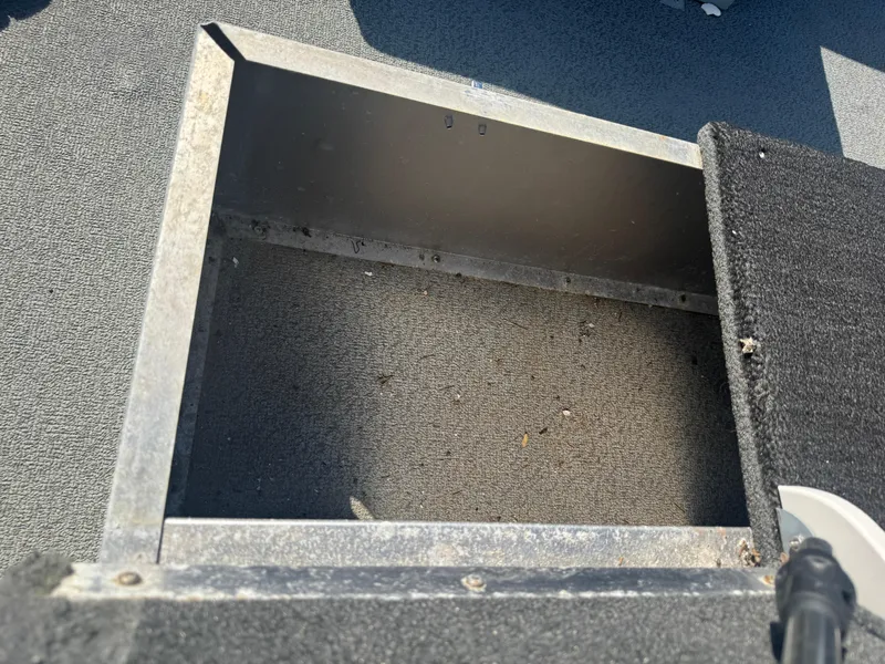 Slide: The Image of Open storage compartment on a 2016 Starcraft SF 14 boat. - 8