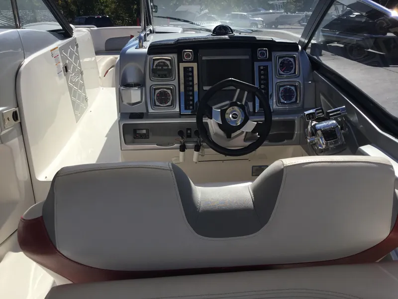 Slide: The Image of 2012 Chaparral 327 SSX boat cockpit with modern steering and control panel. - 12