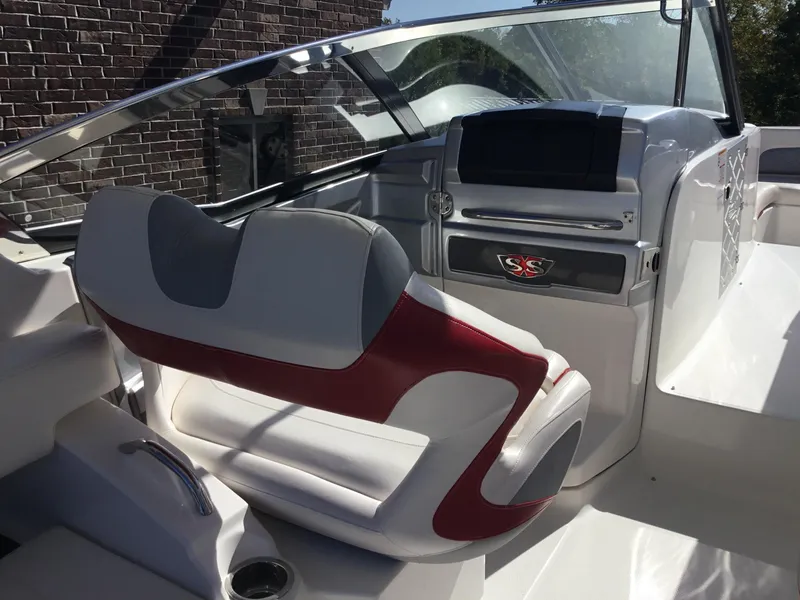 Slide: The Image of Interior of 2012 Chaparral 327 SSX boat with red and white seating. - 17