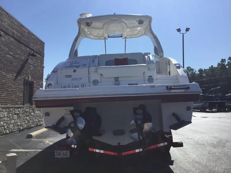 Slide: The Image of 2012 Chaparral 327 SSX boat parked in a lot, rear view. - 2