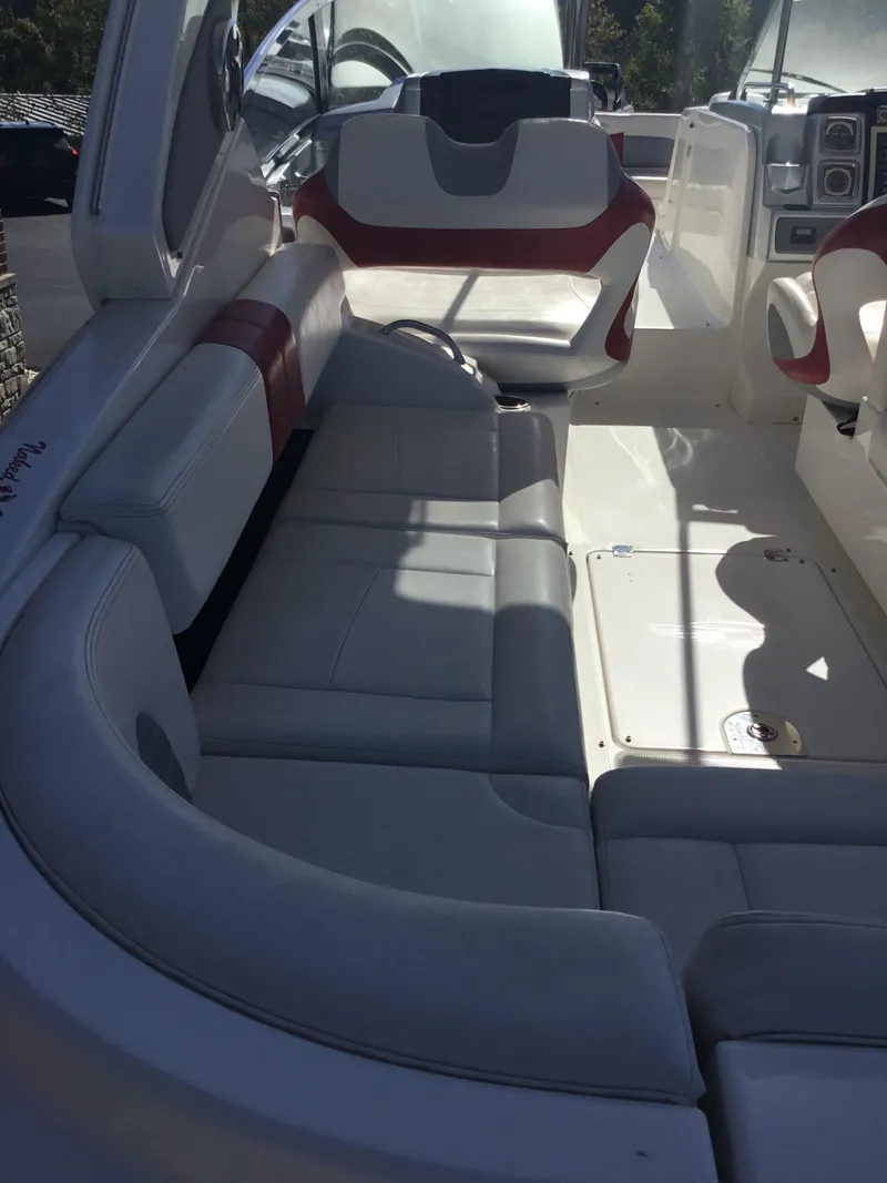 Slide: The Image of 2012 Chaparral 327 SSX boat interior with white and red seating. - 20