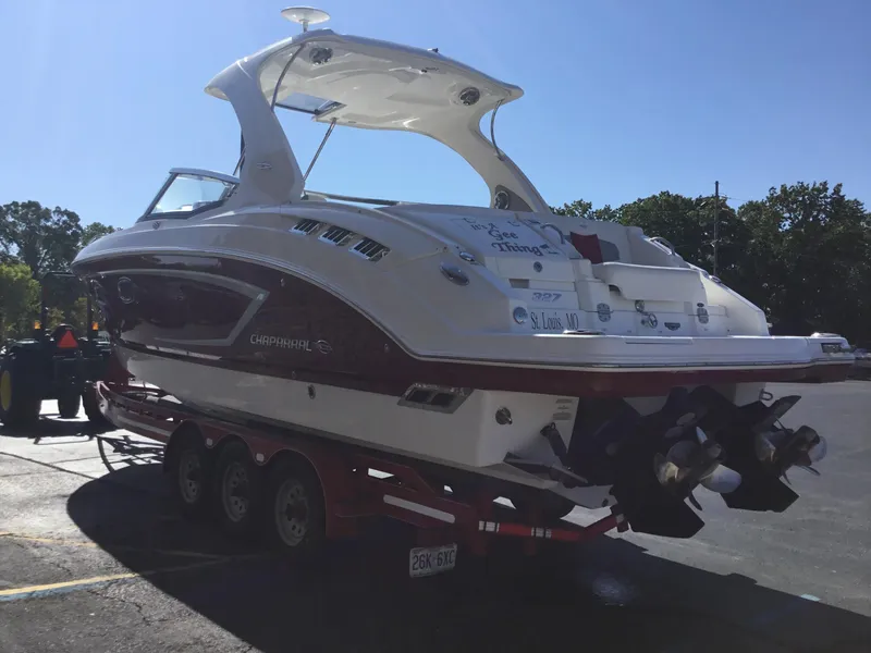 Slide: The Image of 2012 Chaparral 327 SSX boat on trailer in parking lot, rear view. - 3