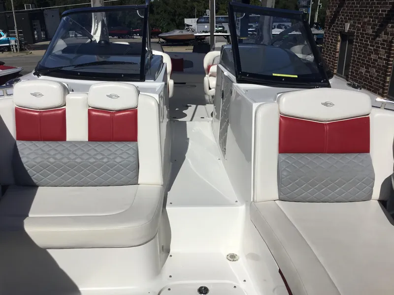 Slide: The Image of 2012 Chaparral 327 SSX boat interior with red and gray seating. - 5
