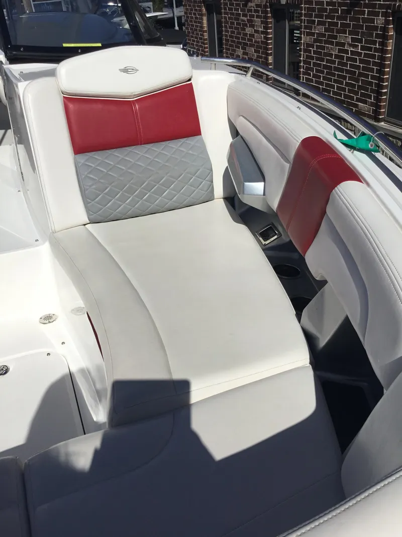 Slide: The Image of 2012 Chaparral 327 SSX boat interior with red and gray seating. - 6