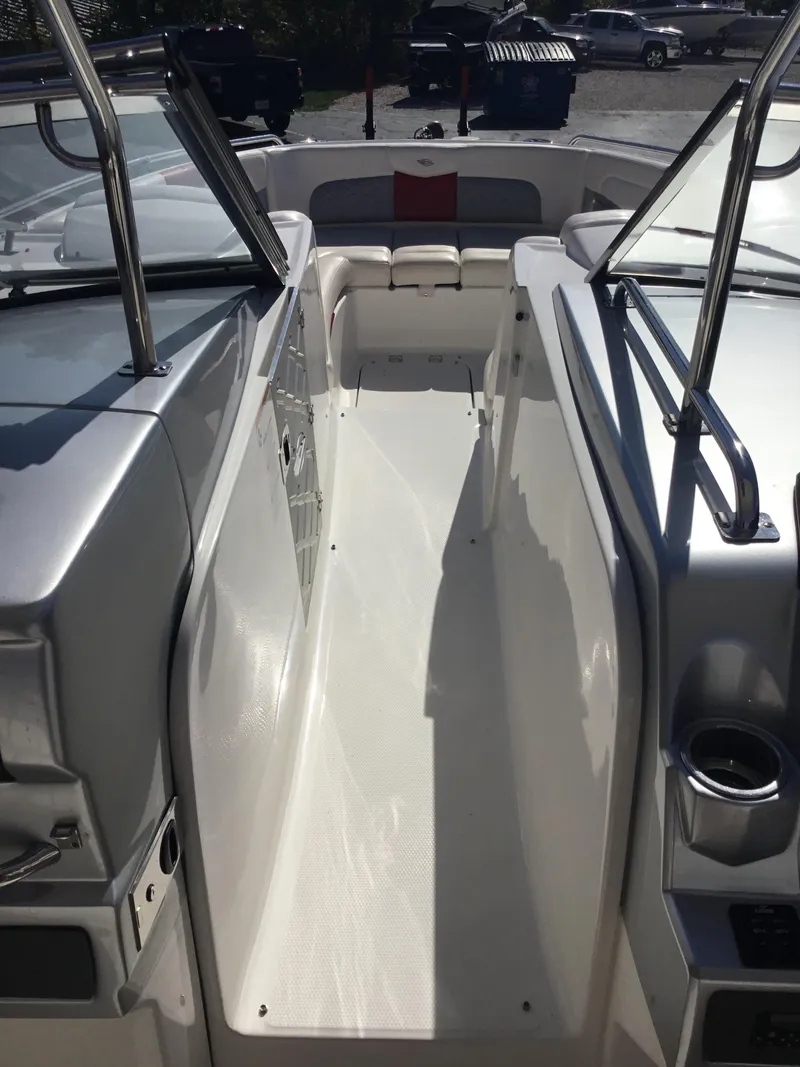 Slide: The Image of 2012 Chaparral 327 SSX boat interior with seating and stainless steel railings. - 9
