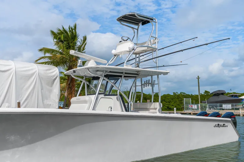 Slide: The Image of 2017 SeaHunter 39 Tournament boat docked, featuring a sleek design and fishing equipment. - 1