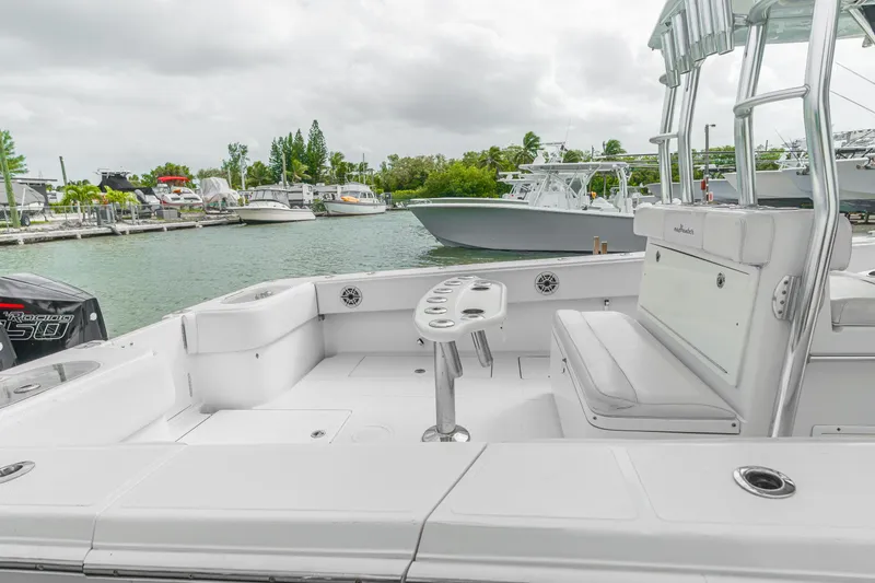 Slide: The Image of 2017 SeaHunter 39 Tournament boat docked, featuring spacious seating and fishing rod holders. - 3