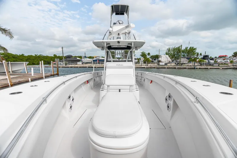 Slide: The Image of 2017 SeaHunter 39 Tournament boat docked, showcasing spacious deck and seating. - 6