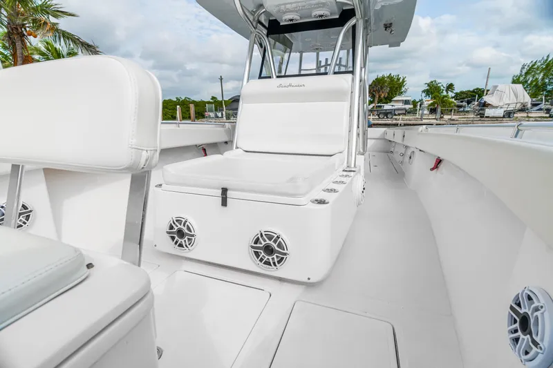Slide: The Image of 2017 SeaHunter 39 Tournament boat interior with white seating and speakers. - 7
