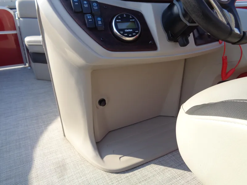 Slide: The Image of 2022 South Bay 222RS boat dashboard with steering wheel and control panel. - 15