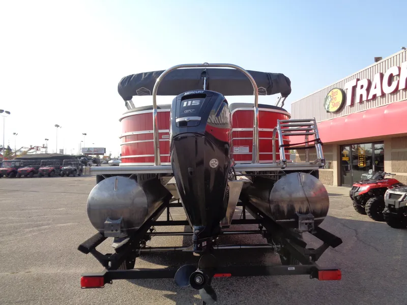 Slide: The Image of 2022 South Bay 222RS pontoon boat with 115 HP engine at dealership. - 3