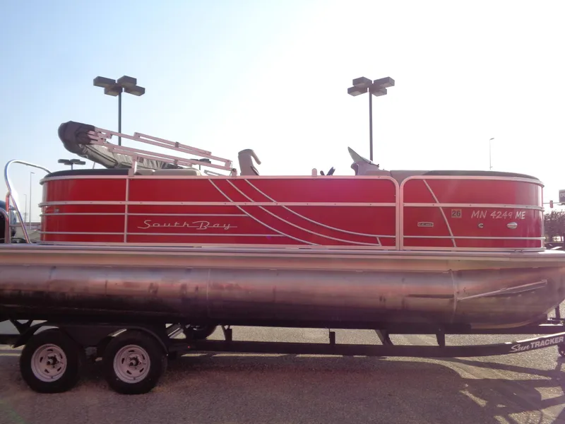Slide: The Image of Red 2022 South Bay 222RS pontoon boat on trailer in parking lot. - 5