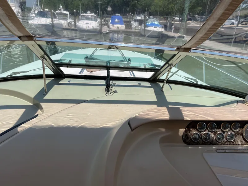 Slide: The Image of 1998 Sea Ray 450 Sundancer yacht dashboard with marina view. - 13
