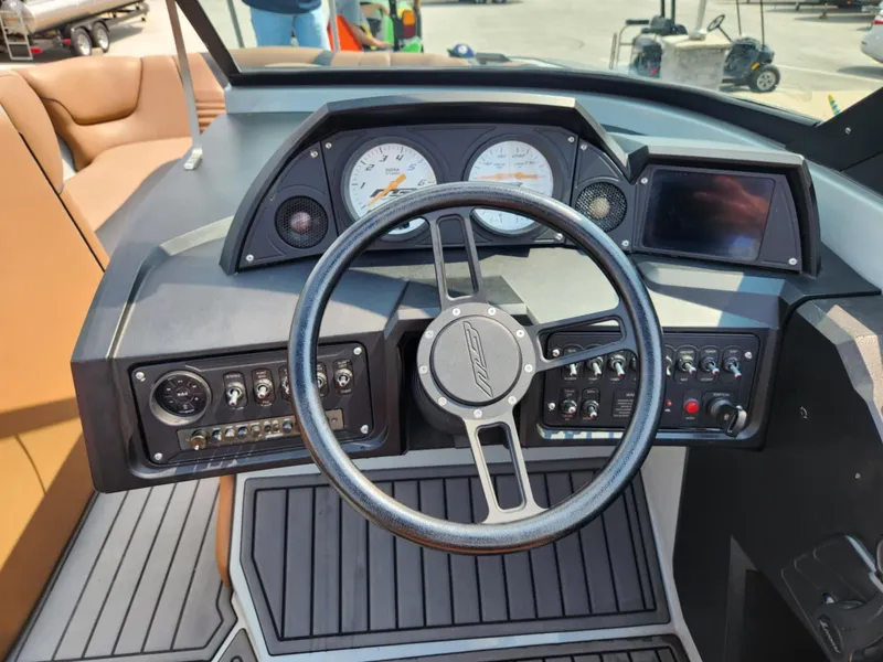 Slide: The Image of 2020 MB F24 Tomcat boat dashboard with steering wheel and control panel. - 11