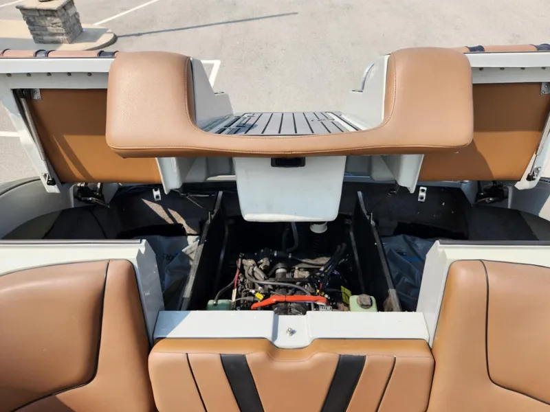 Slide: The Image of 2020 MB F24 Tomcat boat engine compartment with brown seating. - 14