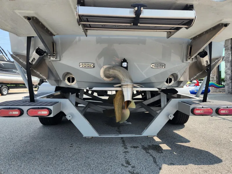 Slide: The Image of Rear view of 2020 MB F24 Tomcat boat on trailer, showing propeller and exhaust. - 18