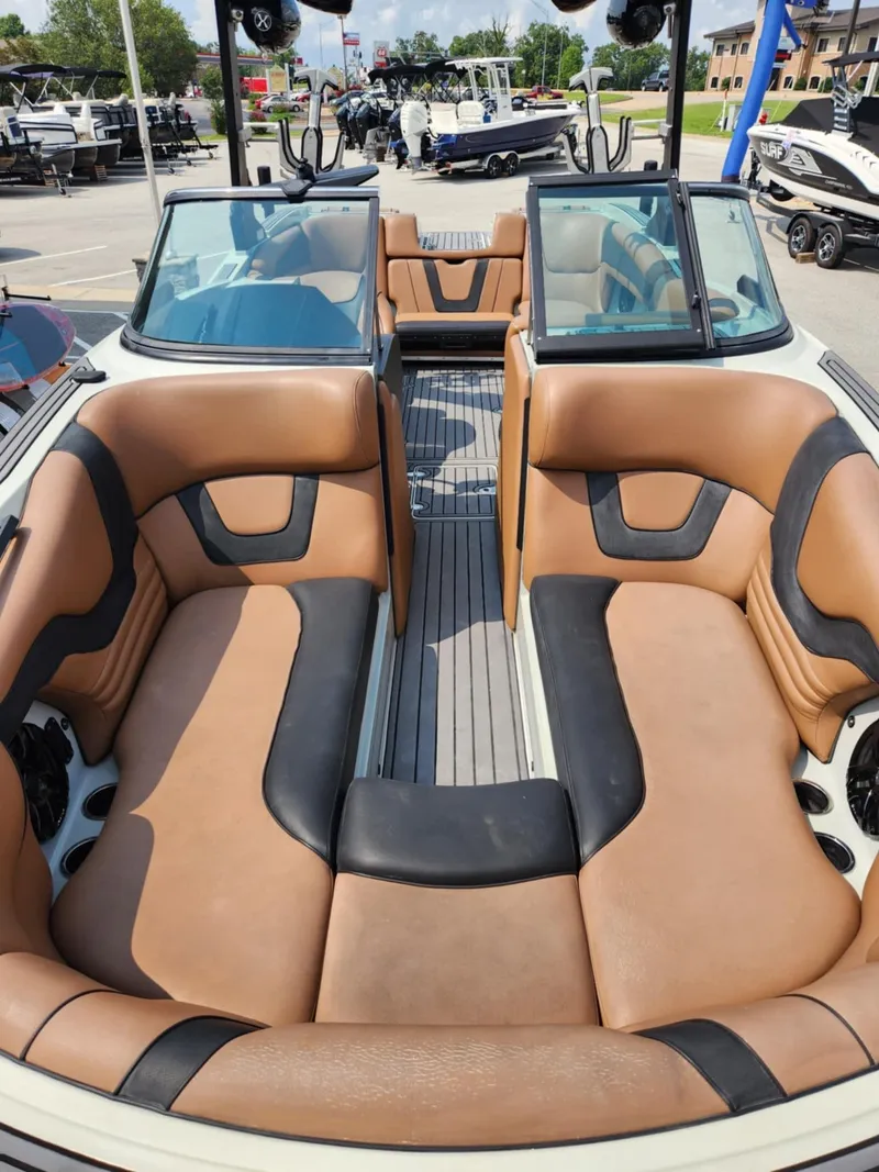 Slide: The Image of 2020 MB F24 Tomcat boat interior with tan and black seating. - 5