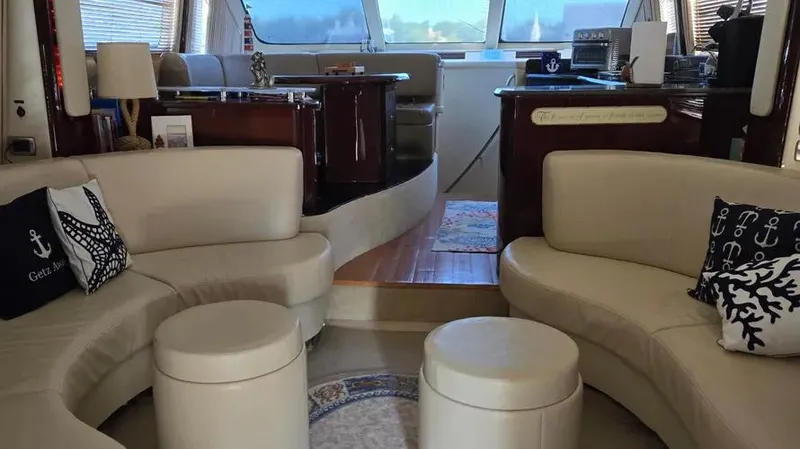 Slide: The Image of Luxurious interior of 2007 Sea Ray 580 Sedan Bridge yacht with elegant seating. - 12