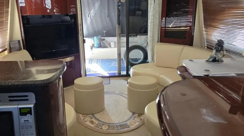 Slide: The Image of Luxurious 2007 Sea Ray 580 Sedan Bridge interior with elegant seating and modern amenities. - 13