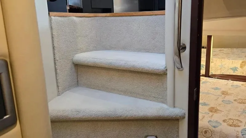 Slide: The Image of Interior stairs of 2007 Sea Ray 580 Sedan Bridge yacht, carpeted steps. - 20
