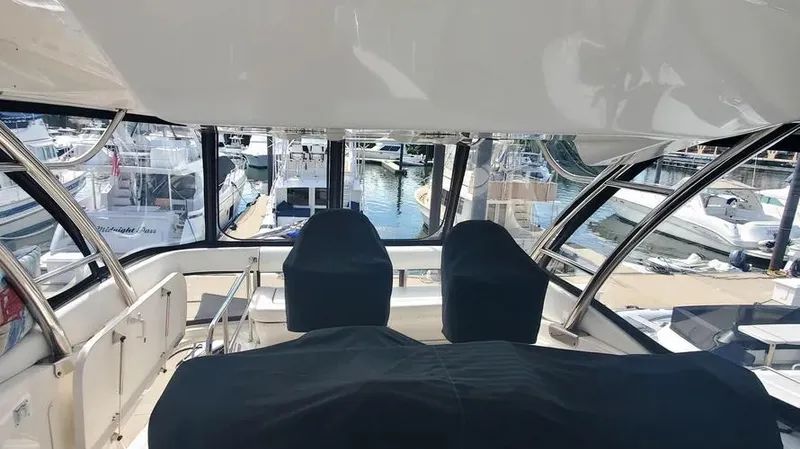 Slide: The Image of Interior view of 2007 Sea Ray 580 Sedan Bridge yacht at marina. - 21