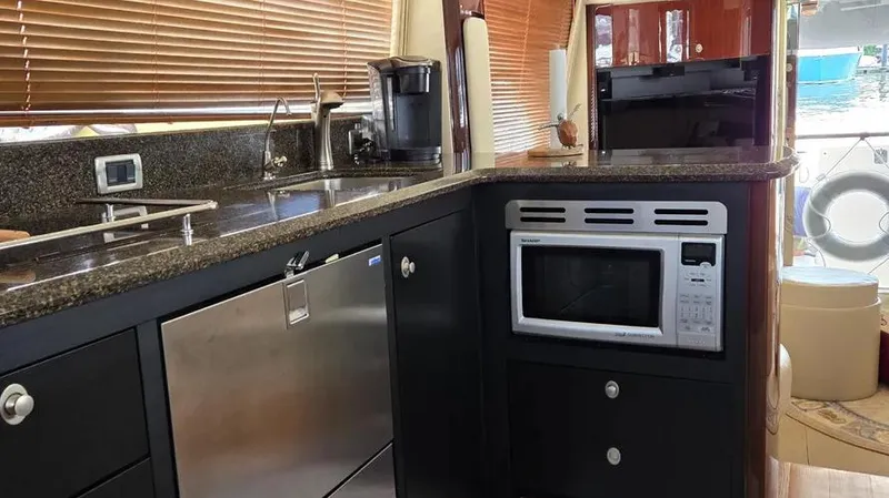 Slide: The Image of Luxurious kitchen interior of 2007 Sea Ray 580 Sedan Bridge yacht. - 22