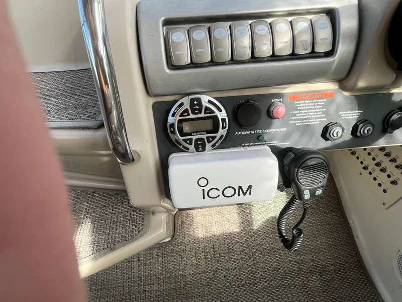 Slide: The Image of Control panel of a 2011 Formula 310 Sun Sport boat with ICOM radio. - 11