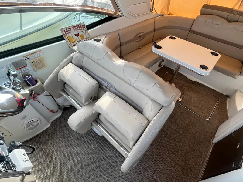 Slide: The Image of 2011 Formula 310 Sun Sport interior with plush seating and table. - 12