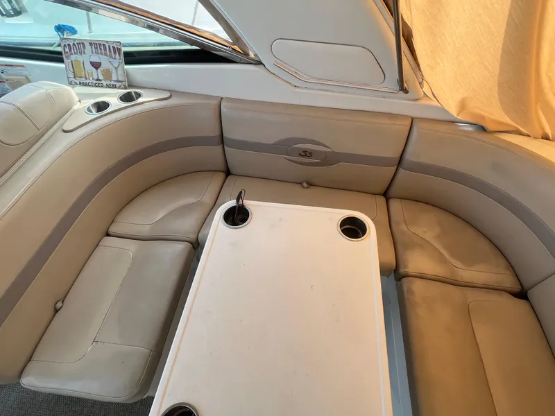 Slide: The Image of 2011 Formula 310 Sun Sport interior with beige seating and table. - 15