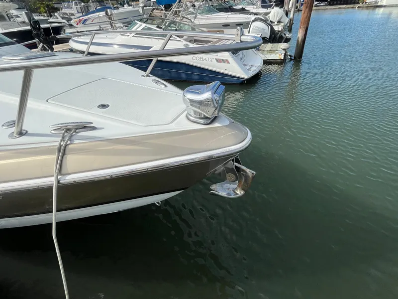 Slide: The Image of 2011 Formula 310 Sun Sport boat docked in marina, front view. - 18