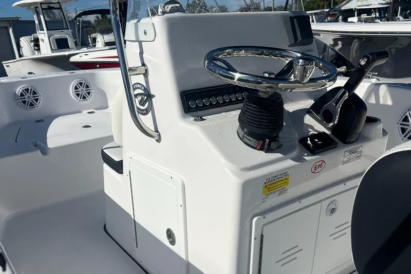Slide: The Image of 2025 Tidewater 180 CC Adventure boat console with steering wheel and controls. - 10