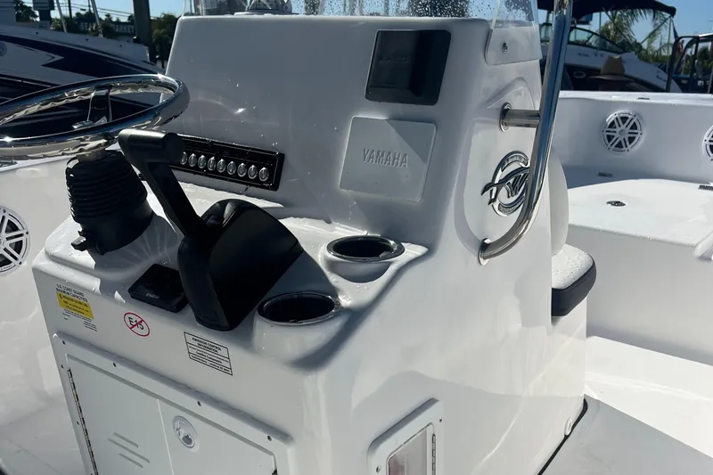 Slide: The Image of 2025 Tidewater 180 CC Adventure boat console with Yamaha controls and steering wheel. - 13