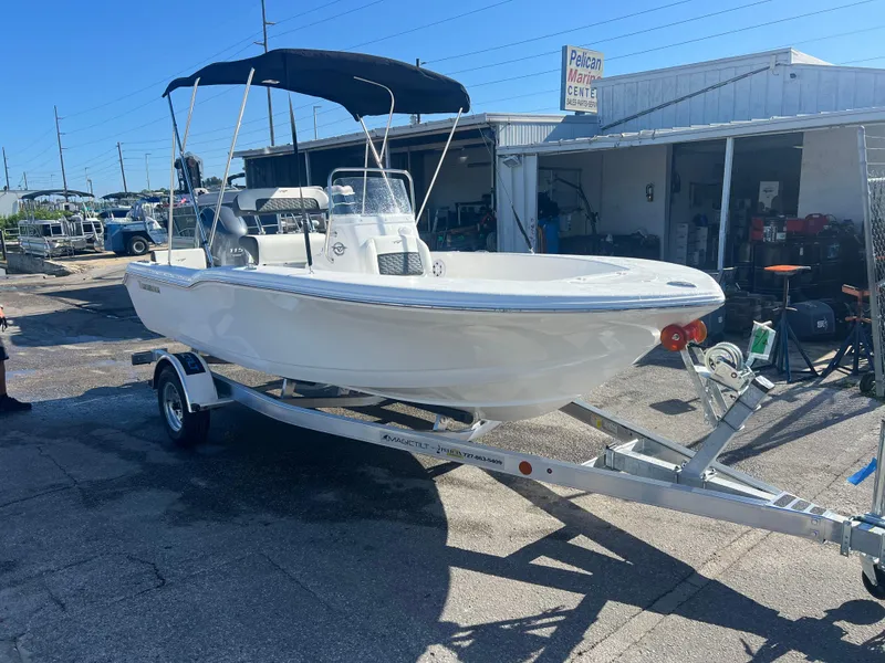 Slide: The Image of 2025 Tidewater 180 CC Adventure boat on trailer, parked outdoors. - 4