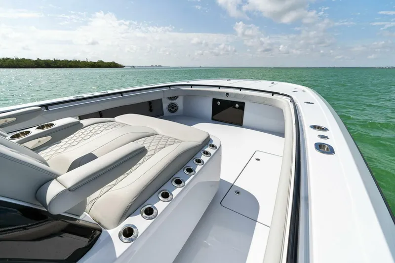 Slide: The Image of 2023 Barker Boatworks 40 High Performance Cat on open water, featuring sleek seating and modern design. - 10
