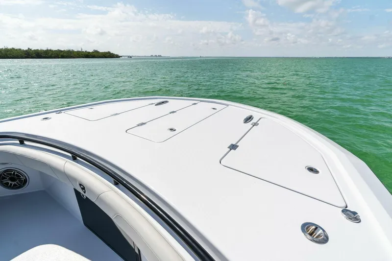 Slide: The Image of 2023 Barker Boatworks 40 High Performance Cat on serene water. - 12