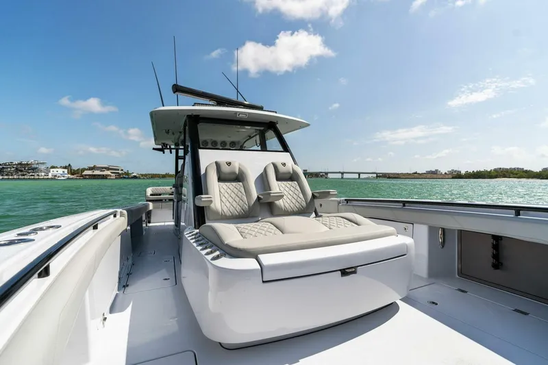 Slide: The Image of 2023 Barker Boatworks 40 High Performance Cat on water, featuring luxurious seating. - 15