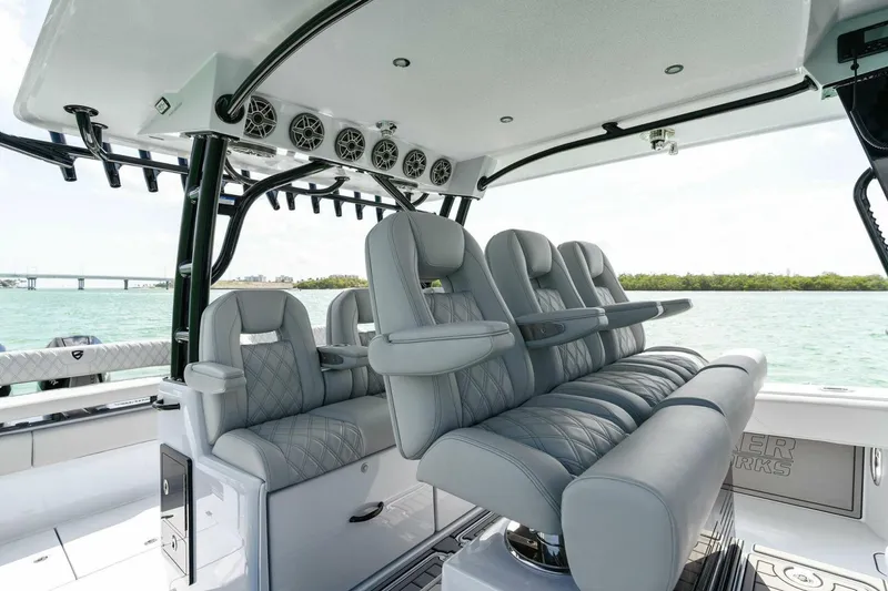 Slide: The Image of Luxurious seating on 2023 Barker Boatworks 40 High Performance Cat, featuring sleek design and ocean backdrop. - 27